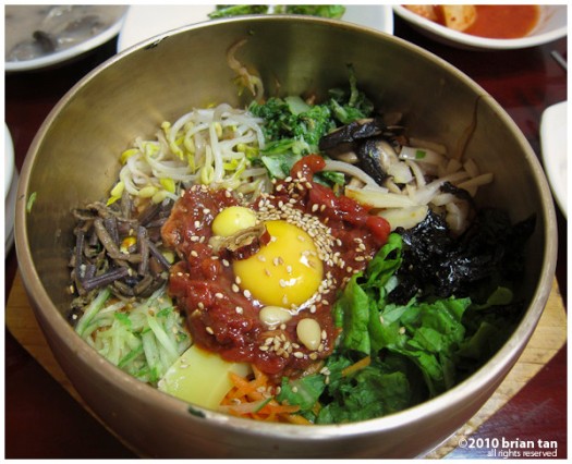  Bibimbap before mixing. The red stuff is the beef. Gochujang is already mixed into the rice under all the toppings. 